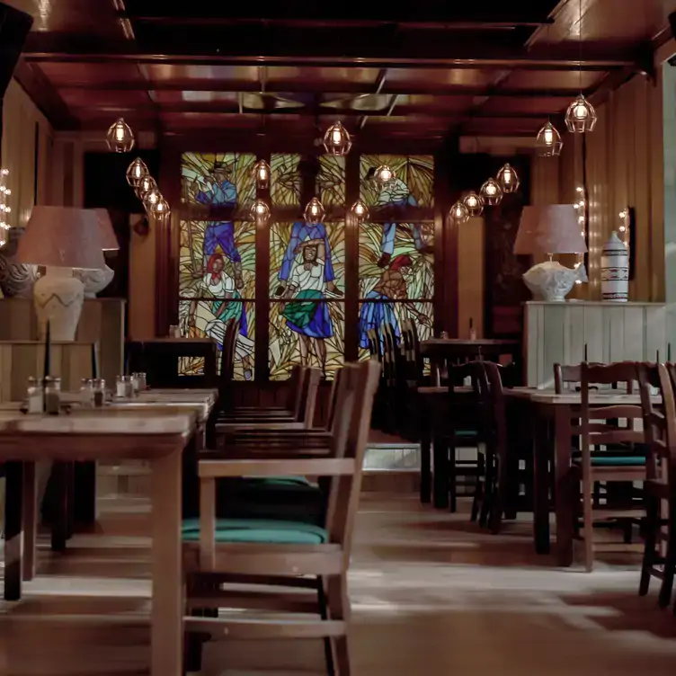 Wooden interiors and stained glass windows at Restaurant Jäger & Lustig in Berlin.